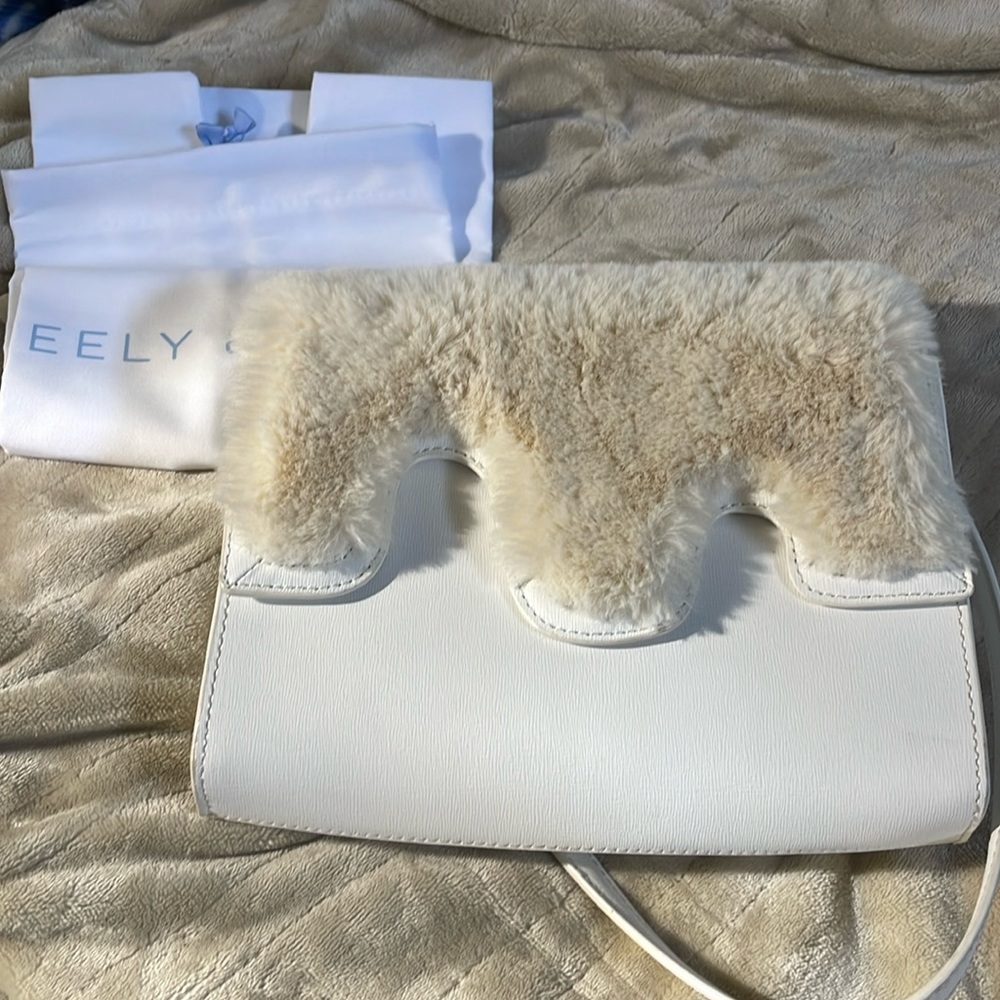 Neely and Chloe bag from Anthropologie. Faux white fur. So cute on totally in